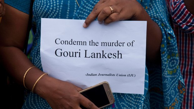 A woman from the Indian Journalists Union calls for condemnation of Lakesh's killing.