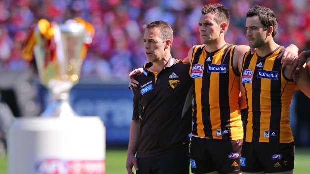 Hawthorn AFL coach Alastair Clarkson, left, was at the centre of the $1.67 billion buyout of vitamins group Swisse Wellness, but didn't know it. 