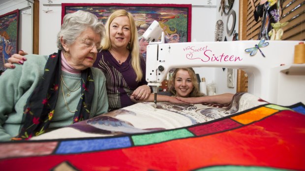 Three generations of quilters: 16-year-old Ineka Voigt, her mum Helen Godden and her grandmother Pat Godden. The trio will all be entering quilts in this year's Canberra Craft and Quilt fair. 