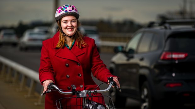 Cyclist Rachel Lynskey is relieved to have a temporary bike railing built on the Commonwealth Avenue bridge. 