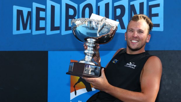 Dylan Alcott with the winner's trophy at the Australian Open 2015 Wheelchair Championships at Melbourne Park in January.