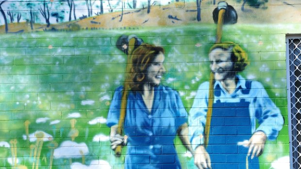 A mural by Byrd at Frencham Place in Downer. The mural is based on a famous wartime photograph of two women of the Australian Land Army going cheerfully off to work. 