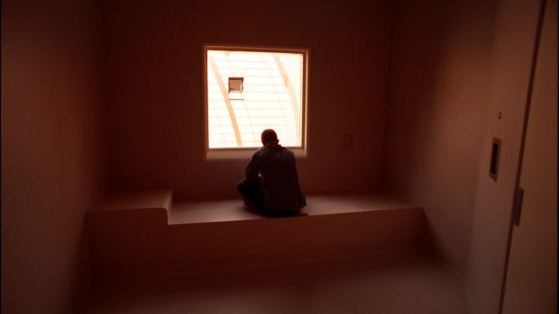 A patient in a seclusion room.