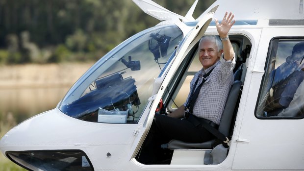 Prime Minister Malcolm Turnbull boards a helicopter to take an aerial tour of Snowy Hydro Tumut 3 power station, at Talbingo, NSW.