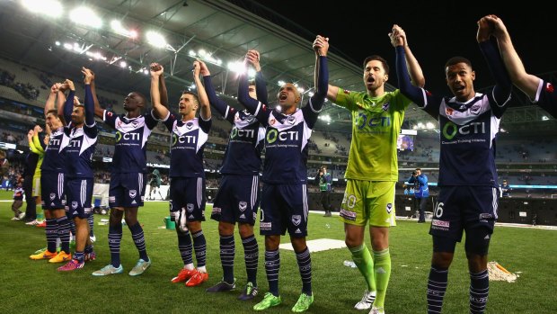 Melbourne Victory players acknowledge their fans after the win on Friday night.