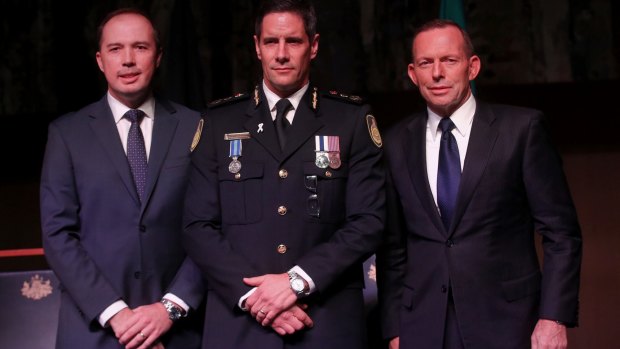 Australian Border Force commissioner Roman Quaedvlieg, centre, with Peter Dutton and then prime minister Tony Abbott.