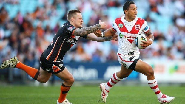 Tiger turned Dragon: Benji Marshall outstrips Blake Austin in his first game against his former club last weekend.
