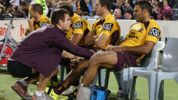 Justin Hodges receives attention from a trainer this season.