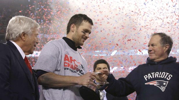 Dream team: Patriots owner Robert Kraft with Tom Brady and Belichick after winning the AFC Championship.