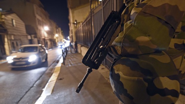 A French soldier outside a synagogue in Marseille, part of an unprecedented deployment of troops on home soil.  