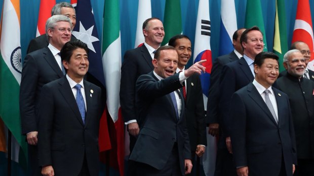 Prime Minister Tony Abbott poses with the G20 leaders for the family photo in Brisbane.