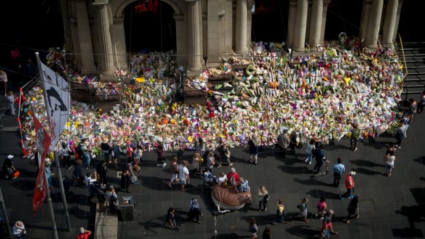 The tribute to victims of the Bourke Street rampage grows on the steps on the GPO.
