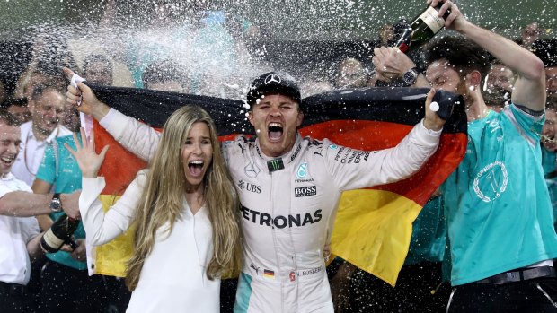 Nico Rosberg celebrates with his wife Vivian after claiming the world title.