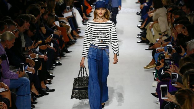 A model wears the t-shirt at the Dior show during Paris Fashion Week. 