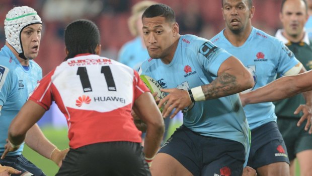 Frustrated: Israel Folau tries to break through the Lions line.