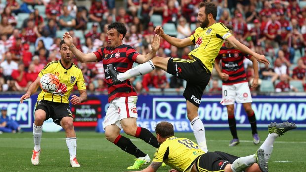 Heads up: Mark Bridge and Andrew Durante contest the ball during the round seven A-League match between Western Sydney Wanderers and Wellington Phoenix at Pirtek Stadium.