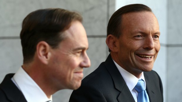 Tony Abbott, with his former environment minister Greg Hunt, says climate change "might even be beneficial".