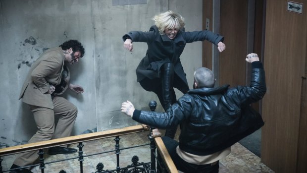 Charlize Theron, centre, punches through her paces.