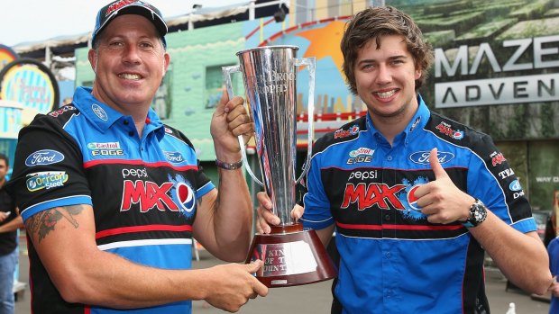 Bathurst 1000 winners Paul Morris and Chaz Mostert with the Peter Brock Trophy at Luna Park last week.