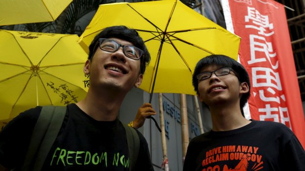 Charged with obstructing police: Student leaders Nathan Law (left) and Joshua Wong  on Tuesday.