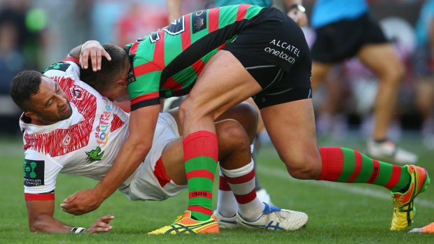 Too strong: Benji Marshall is wrestled to the ground by Souths' Jack Gosiewski.