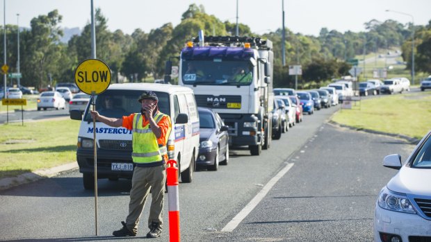 Southbound traffic on Woodcock Drive is stopped to allow extra northbound traffic though due to congestion caused by the Tharwa Drive closure.