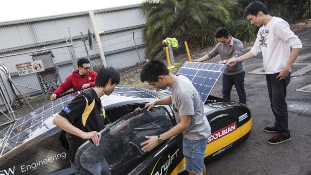 Record breaking: University of NSW students Kevin Moonyong Kim, Anthony Li, Gabriel Mendoza, Daniel Chen and James Sutanto prepare the Sunswift solar car.