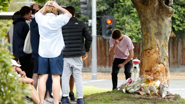 Class mates and friends visit the scene of the car crash in Malvern East.