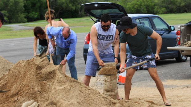 Huge piles of sand were dumped at Lou Lister Park for local residents to dig into with shovels and sandbags.