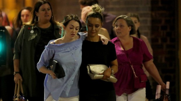 Shocked concert goers leave Manchester Arena after the blast.