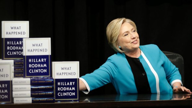 Hillary Rodham Clinton prepares to sign copies of her book "What Happened" at a book store in New York.