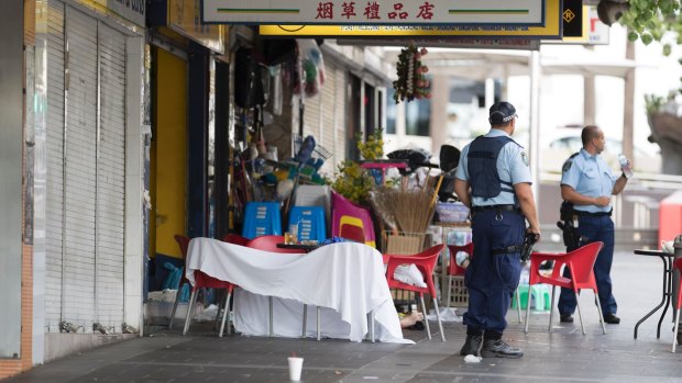 Police guard the crime scene where the criminal lawyer was shot dead.