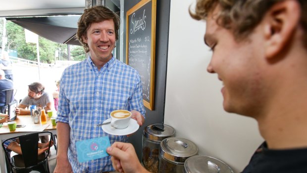 Former Sydney marketing executive Jono Fisher (left) purchased a coffee for a stranger as part of those leading a charge to cultivate compassion in everyday life. T