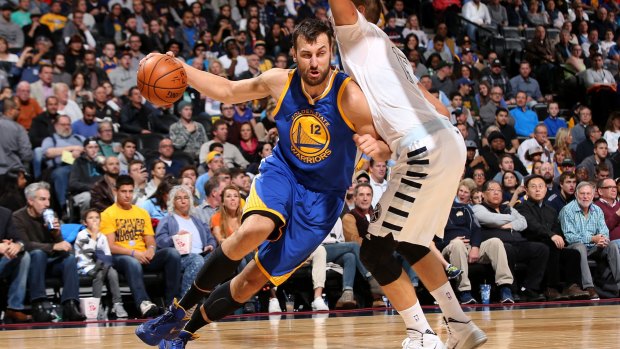 Aussies in the NBA: Andrew Bogut drives against the Denver Nuggets.