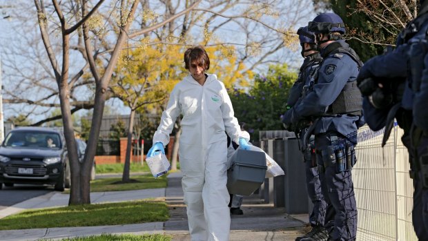 A forensics police officer arrives at a Pascoe Vale property on Tuesday.
