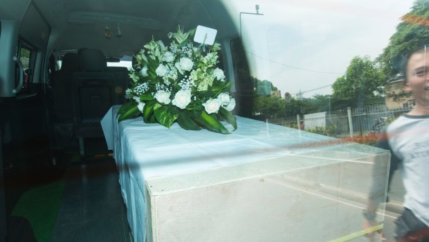 One of the coffins heads to Jakarta airport.