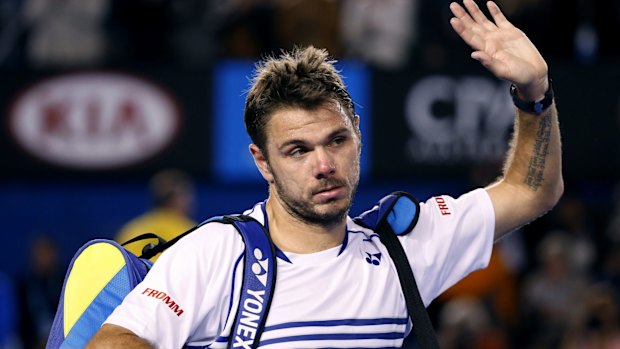 Sad farewell: Defending champion Stan Wawrinka leaves Rod Laver Arena after losing in five sets.