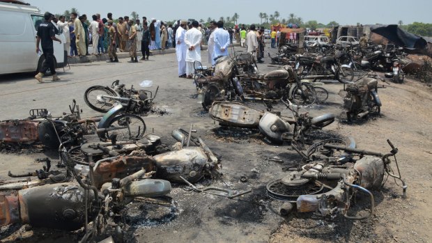 Eyewitnesses said about 30 motorcycles that had carried villagers to the accident site lay in charred ruins nearby. 