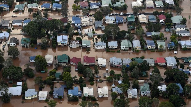 Floodwaters from the Wilsons River engulf homes in central Lismore.
