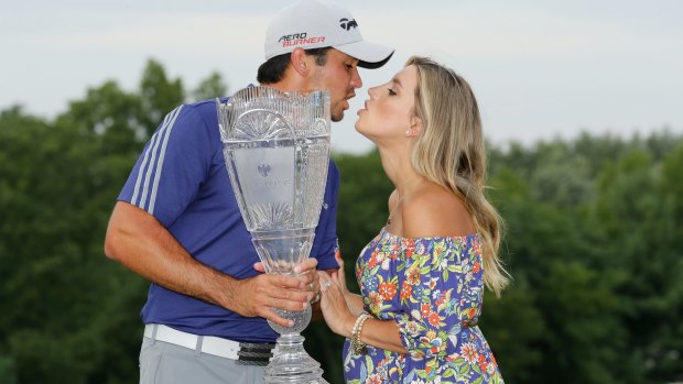 Jason Day of Australia with his wife Ellie after his six-stroke victory at The Barclays at Plainfield Country Club on August 30.