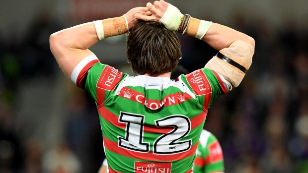 Can't watch: Angus Crichton turns away after another Storm try.