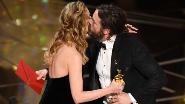 Brie Larson, congratulates Casey Affleck as he accepts the award for best actor in a leading role for Manchester by the Sea.