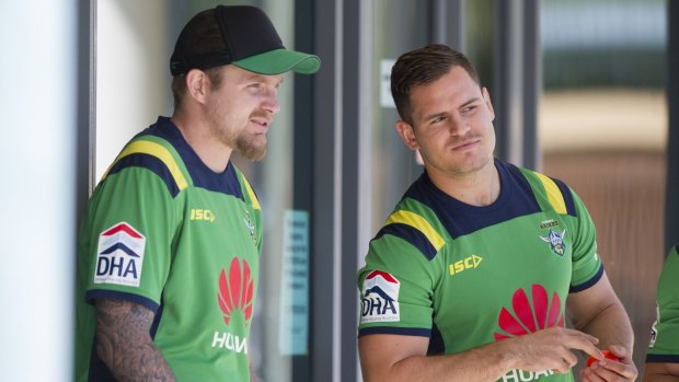 Canberra Raiders halves Blake Austin and Aidan Sezer have a chat before the start of pre-season training on Monday. 