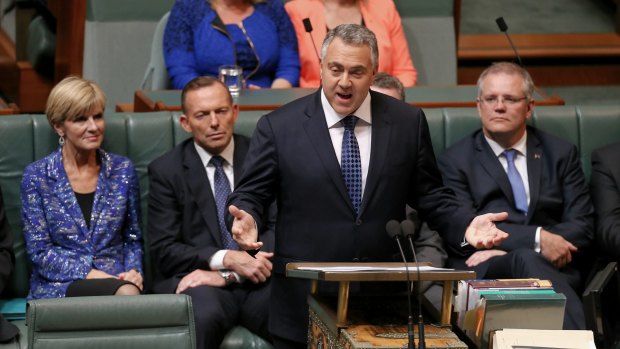 Treasurer Joe Hockey hands down the Budget in the House of Representatives at Parliament House.