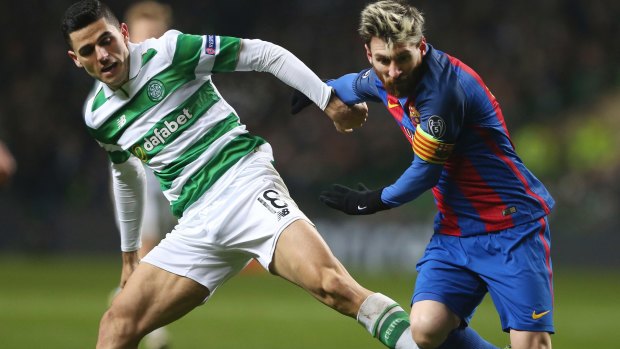 Canberra export and Celtic striker Tom Rogic taking on Barcelona superstar Lionel Messi in the Champions League.