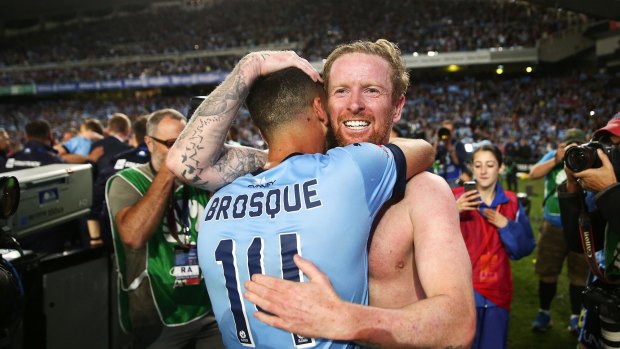 Alex Brosque and David Carney of Sydney celebrate after the penalty shoot-out in the 2017 A-League grand final.