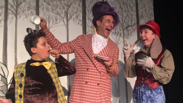 William Best, left, as The Dormouse, Jim Adamik as The Mad Hatter, and Oliver Johnstone as The March Hare in Ickle Pickle's Alice in Wonderland.