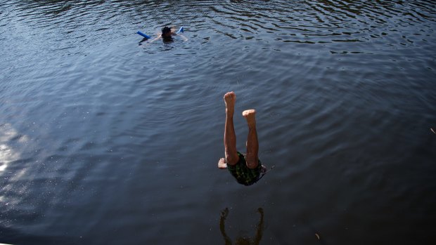 Locals cool off at Parramatta Lake.