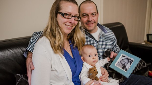 Nicole and Andrew Carroll with their four-month-old daughter, Isobel. Their son, Samuel, died as a result of complications in childbirth.