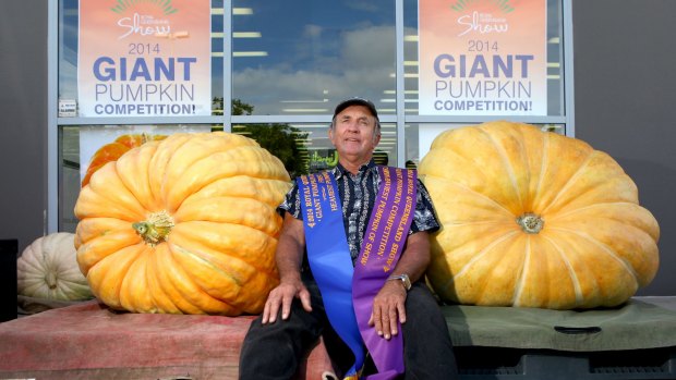 Geoff Frohloff with his giant Atlantic pumpkin. At 204kg, it was named the Champion Heaviest Pumpkin of the Royal Queensland Show 2014. 